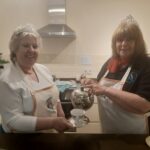 Image showing some of the HiJacker team serving tea with a smile at the Rowhill Field Centre